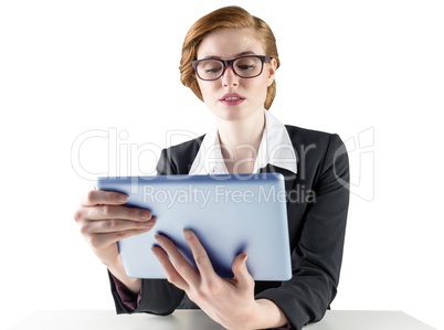 Redhead businesswoman using her tablet pc