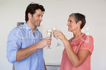 Casual successful business team toasting with champagne