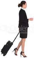 Businesswoman pulling her suitcase
