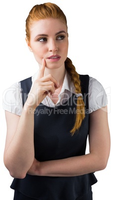 Thinking pretty redhead businesswoman with finger on chin