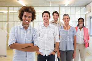 Group of business people being cheerful and smiling at camera