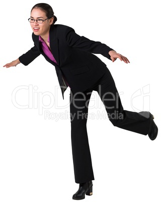 Businesswoman stepping and balancing