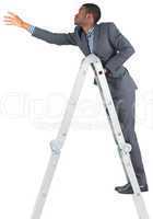 Businessman climbing up ladder