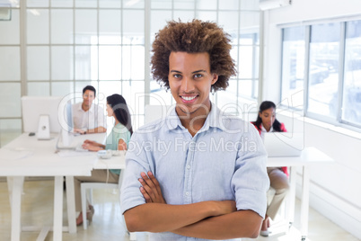 Worker looking at camera with his arms folded