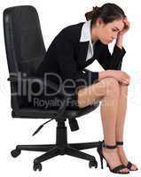 Worried businesswoman on swivel chair