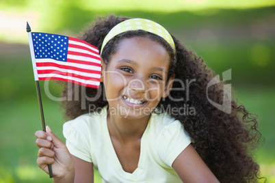 Young girl celebrating independence day in the park