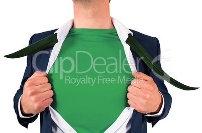 Businessman opening shirt in superhero style Businessman opening shirt in superhero style