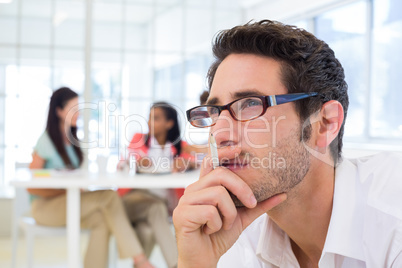 Casual businessman with glasses concentrating