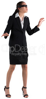 Blindfolded businesswoman with hands out