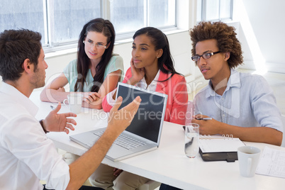 Four coworkers having a discussion