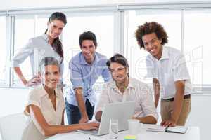 Business people working on laptop smile to camera