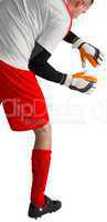 Goalkeeper in red and white ready to catch