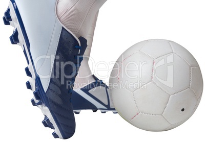 Close up of football player kicking ball