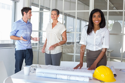 Workers looking at construction plans