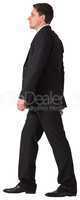 Handsome businessman in suit stepping