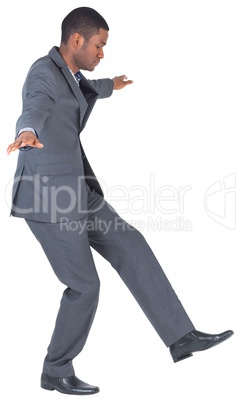 Businessman performing a balancing act