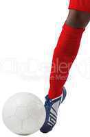 Football player kicking ball with boot