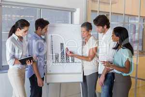 Business people working on graph for presentation