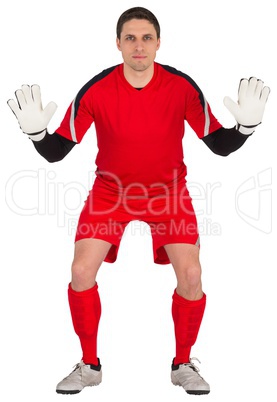 Fit goal keeper looking at camera