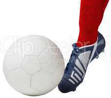 Football player kicking ball with boot