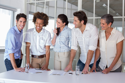 Casual business team having a meeting standing