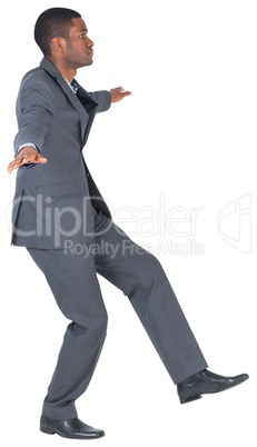 Businessman performing a balancing act