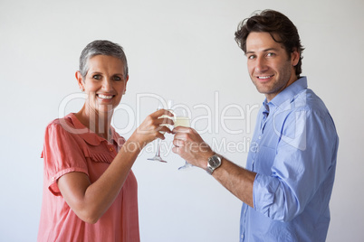 Casual successful business team toasting with champagne