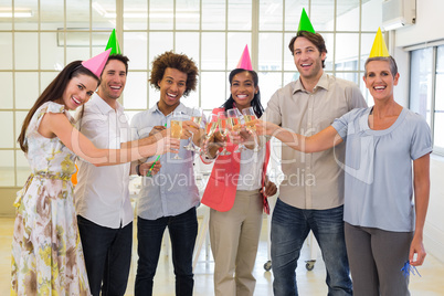 Colleagues celebrate success by having a party and smile at came