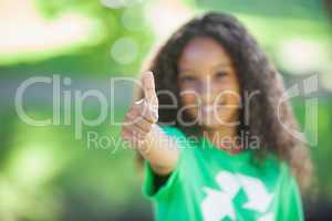 Young environmental activist smiling at the camera showing thumb