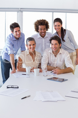 Attractive business people smiling in the workplace