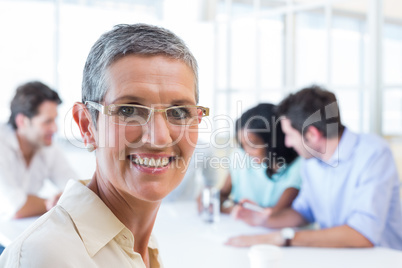 Happy businesswoman smiling at the camera