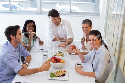 Workers enjoying sandwiches for lunch