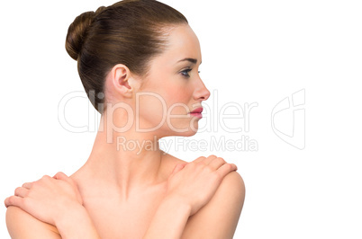 Natural beauty posing with hands on shoulders