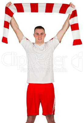 Football player holding striped scarf