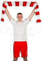 Football player holding striped scarf