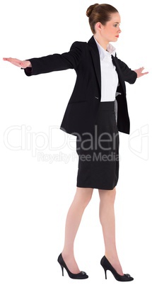 Businesswoman performing a balancing act