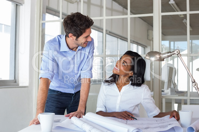 Architects communicating happily about work