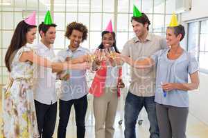 Coworkers celebrate success with champagne and a party