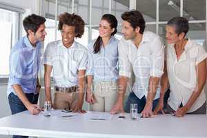 Casual business team having a meeting standing