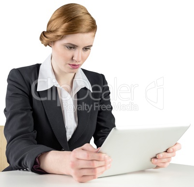 Redhead businesswoman using her tablet pc