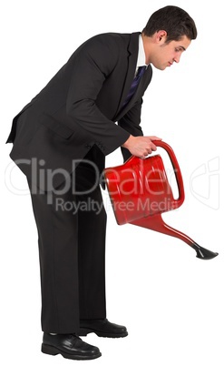 Businessman watering with red can