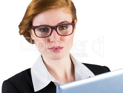 Redhead businesswoman using her tablet pc