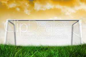 Goalpost on grass under yellow sky