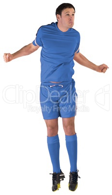 Football player in blue jumping
