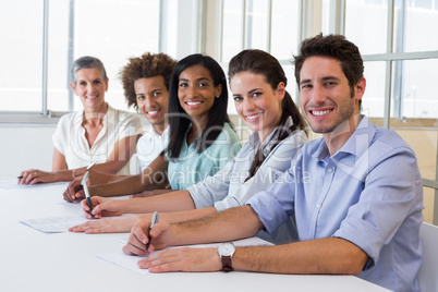 Group of workers looking at camera