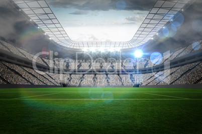 Large football stadium with lights