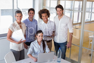 Happy business workers smiling at the camera