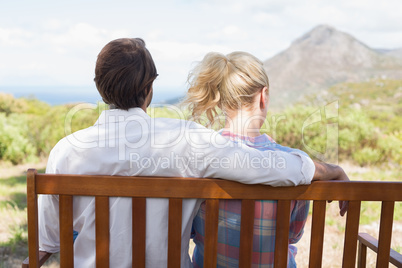 Cute couple sitting on bench together