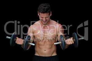 Strong crossfitter lifting up heavy black dumbbells