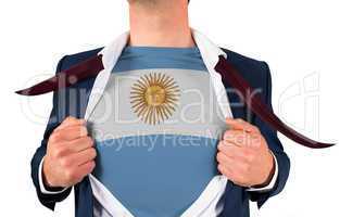 Businessman opening shirt to reveal argentina flag